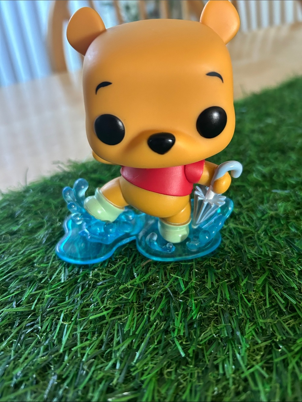 Disney Yellow & Red Pooh Figure with Translucent Blue Base